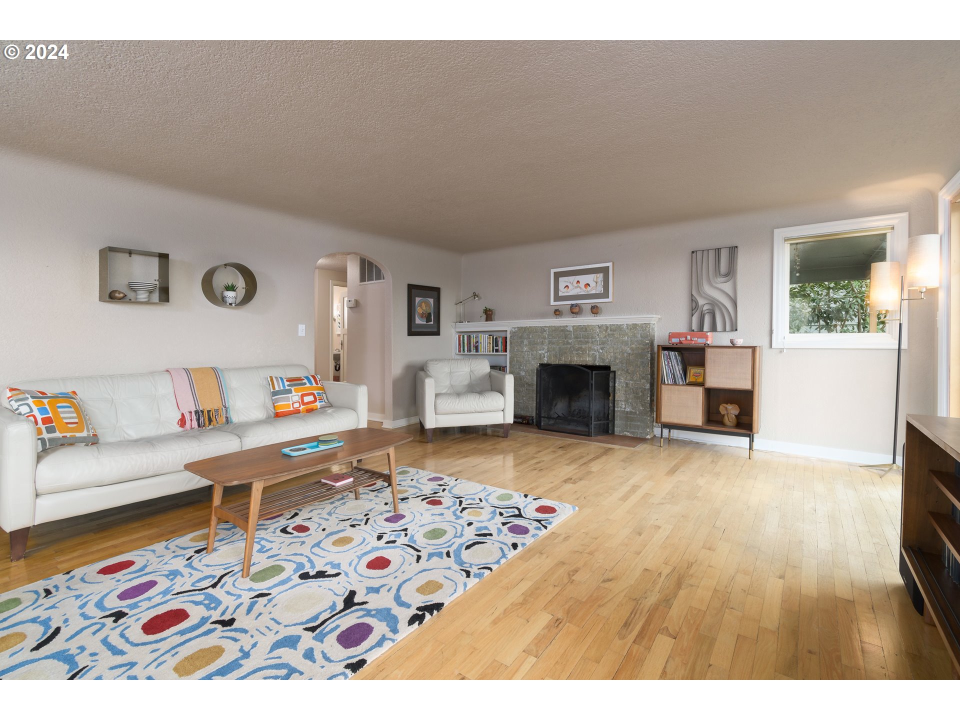 2614 Van Ness Street Eugene, OR 97403 - Photo 6 of 38 a living room with furniture and a fireplace