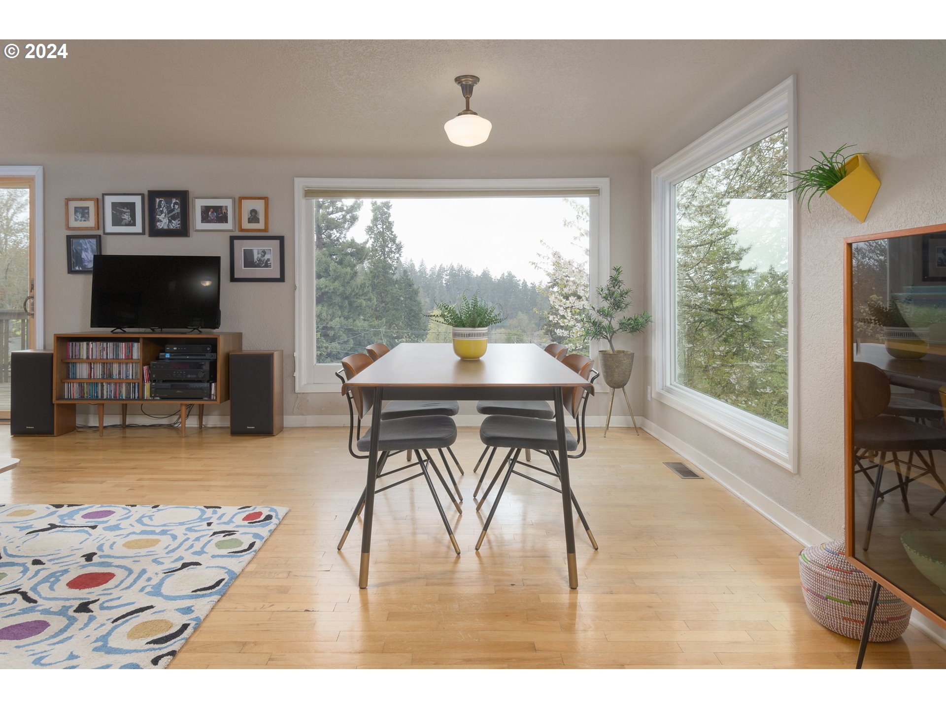 2614 Van Ness Street Eugene, OR 97403 - Photo 7 of 38 a living room with furniture a window and a flat screen tv