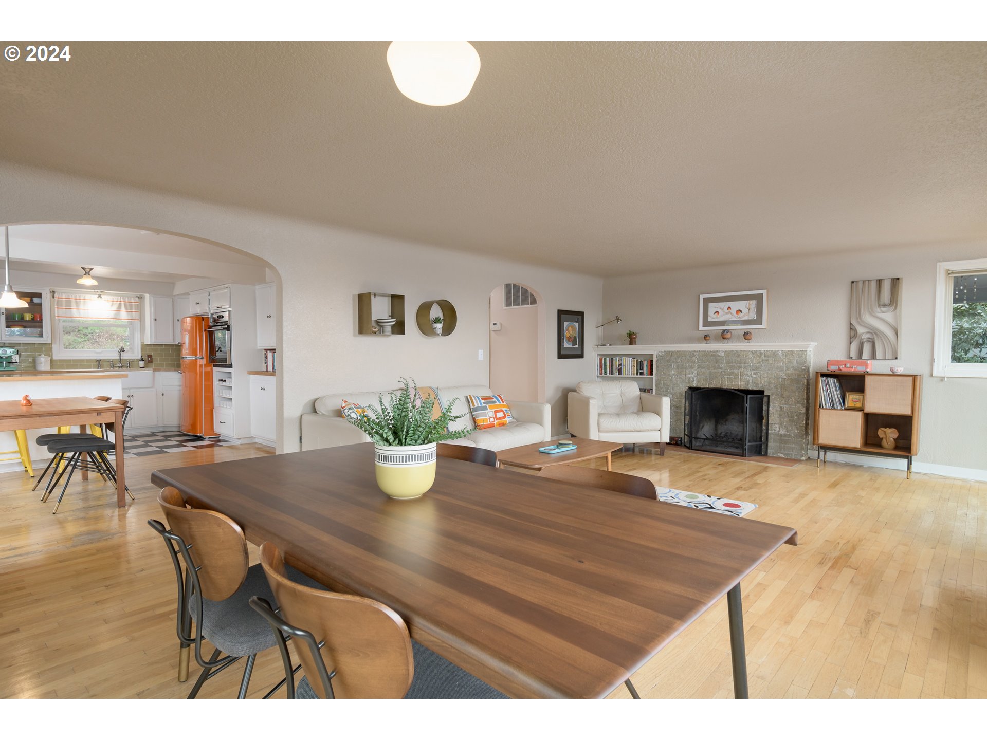 2614 Van Ness Street Eugene, OR 97403 - Photo 9 of 38 a view of a dining room with furniture and a fireplace