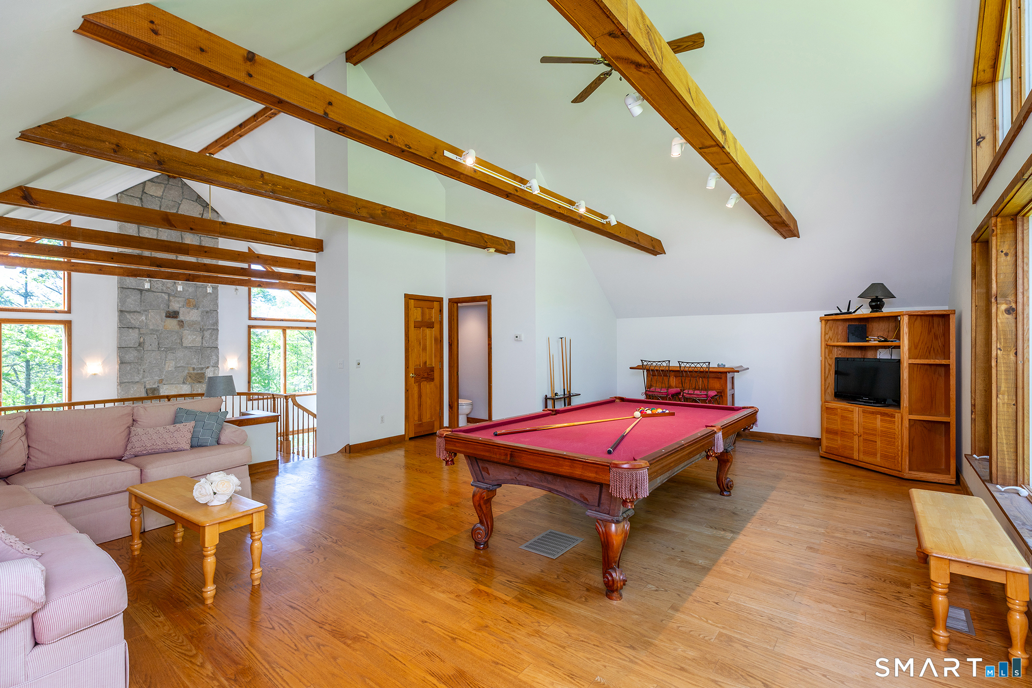 3 Old Forest Road Sherman, CT 06784 - Photo 22 of 38 a bedroom with furniture and gym equipment