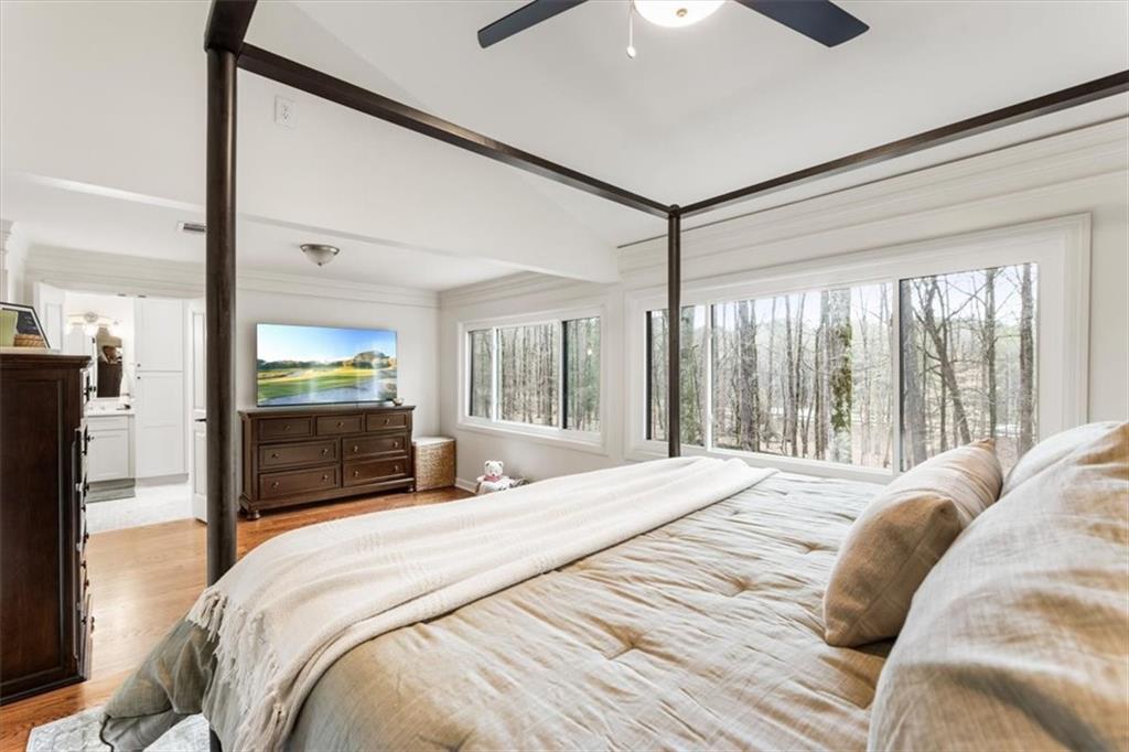 2415 Roxburgh Drive Roswell, GA 30076 - Photo 27 of 62 a bedroom with a large bed and a large window