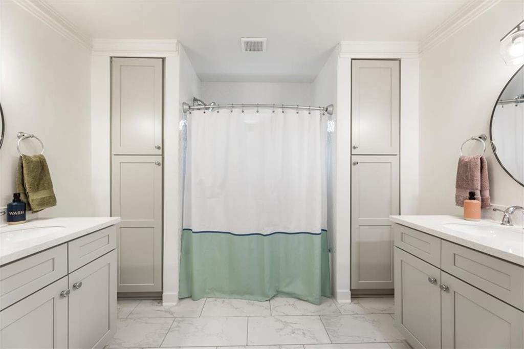 2415 Roxburgh Drive Roswell, GA 30076 - Photo 37 of 62 a bathroom with a sink and a mirror
