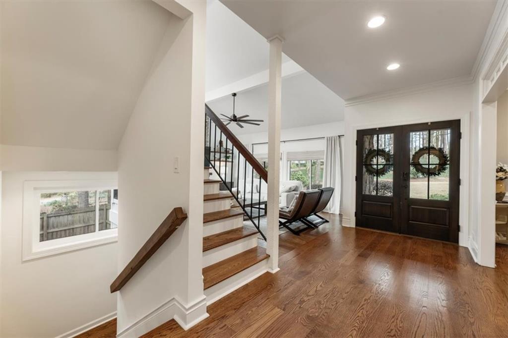 2415 Roxburgh Drive Roswell, GA 30076 - Photo 38 of 62 a view of staircase with wooden floor and a rug