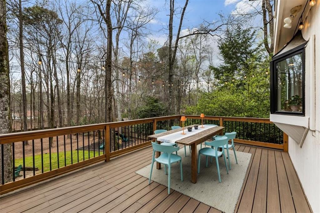 2415 Roxburgh Drive Roswell, GA 30076 - Photo 47 of 62 a balcony with wooden floor table and chairs