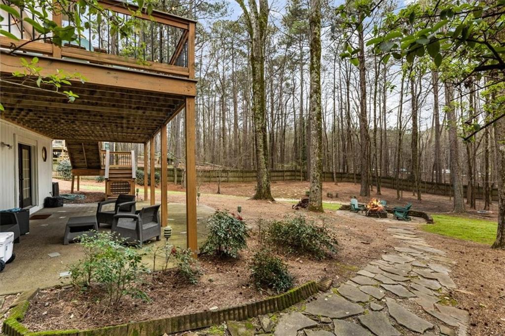 2415 Roxburgh Drive Roswell, GA 30076 - Photo 48 of 62 a view of a backyard with sitting area