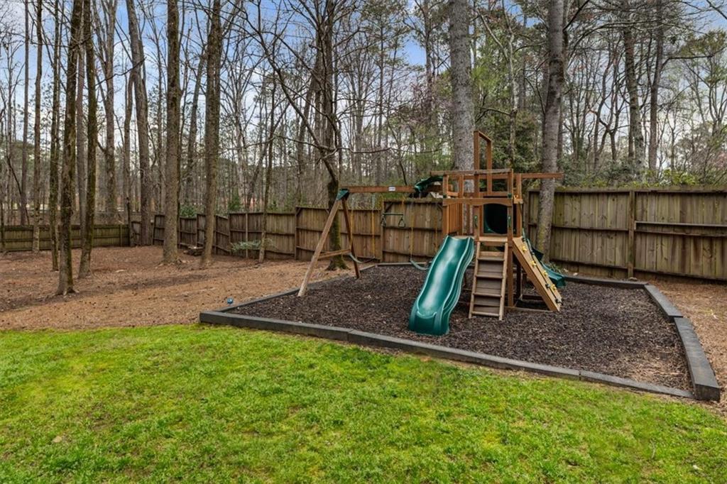 2415 Roxburgh Drive Roswell, GA 30076 - Photo 51 of 62 a view of outdoor space with playground and green space