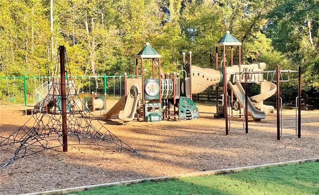2415 Roxburgh Drive Roswell, GA 30076 - Photo 60 of 62 a view of a park with swings and slides