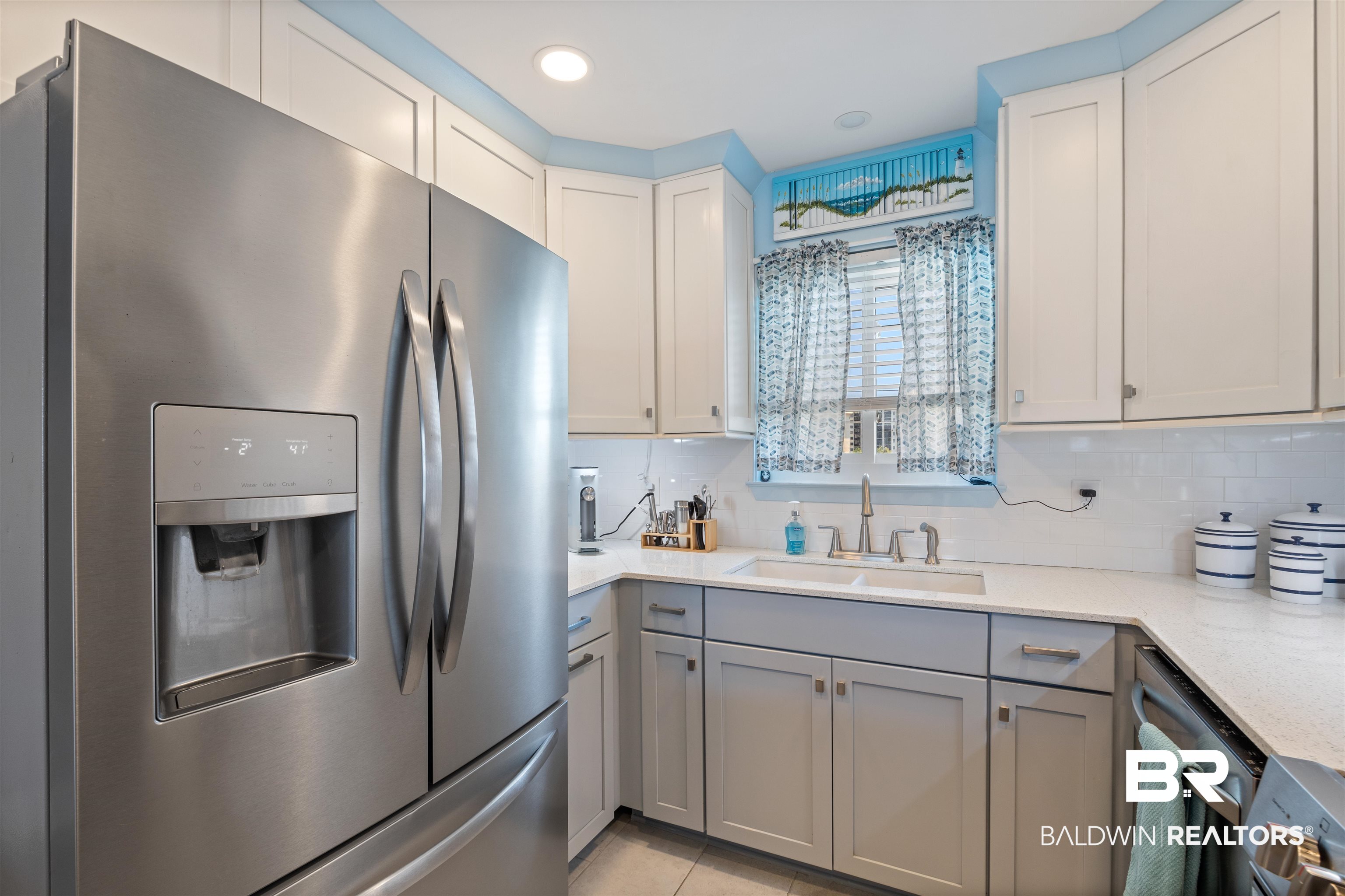 14100 River Road, Unit 327B Perdido Key, FL 32507 - Photo 10 of 46 Kitchen featuring appliances with stainless steel finishes, light stone countertops, gray cabinetry, decorative backsplash, and recessed lighting
