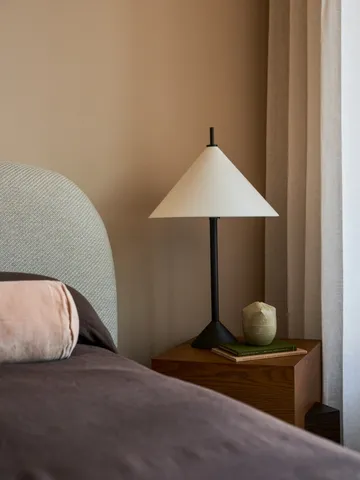 a bedroom with a bed and a chair