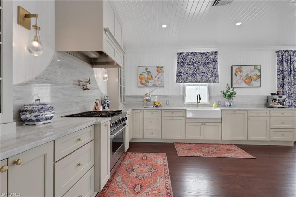 2582 First Street Fort Myers, FL 33901 - Photo 12 of 35 a kitchen with a sink stove and cabinets