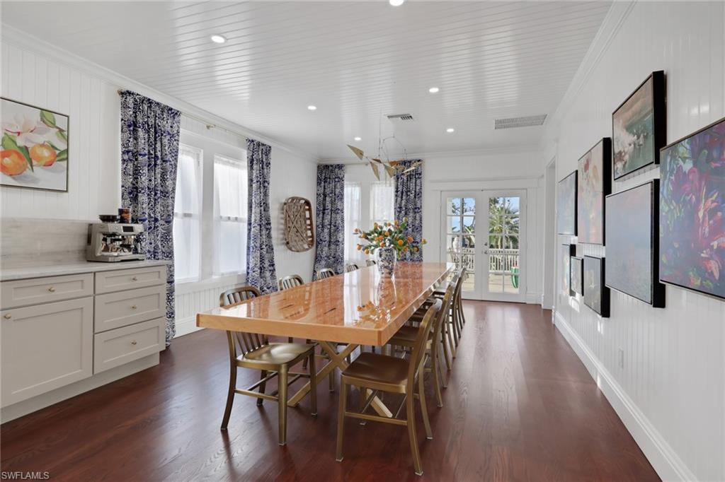 2582 First Street Fort Myers, FL 33901 - Photo 15 of 35 a view of a dining room with furniture and wooden floor