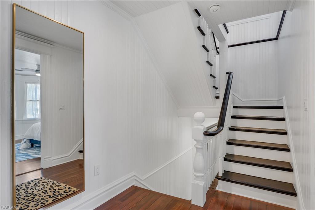 2582 First Street Fort Myers, FL 33901 - Photo 19 of 35 a view of entryway with stairs and wooden floor