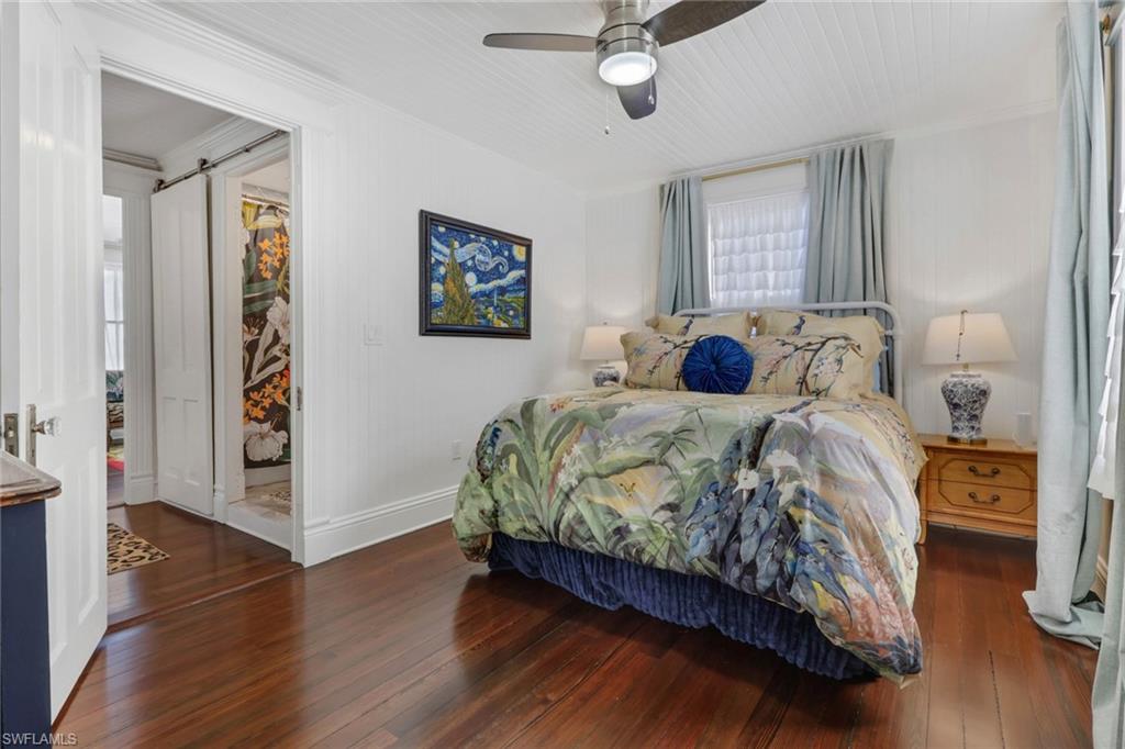 2582 First Street Fort Myers, FL 33901 - Photo 20 of 35 a bedroom with a bed and a painting on the wall