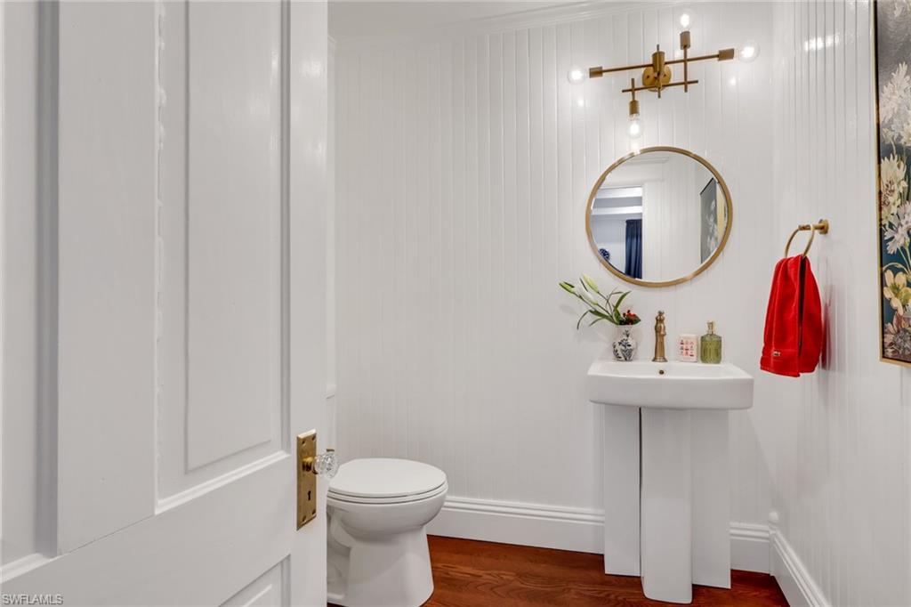 2582 First Street Fort Myers, FL 33901 - Photo 23 of 35 a bathroom with a sink and mirror with toilet