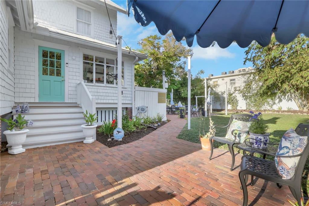 2582 First Street Fort Myers, FL 33901 - Photo 29 of 35 a view of a chair and table in backyard of the house