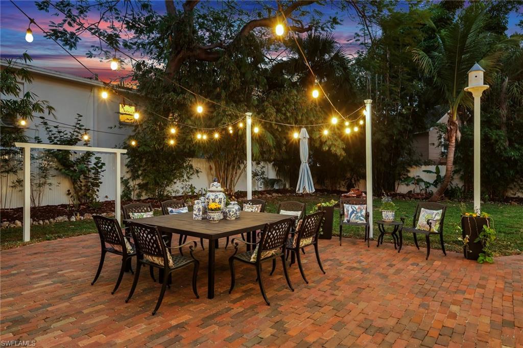 2582 First Street Fort Myers, FL 33901 - Photo 32 of 35 a view of a patio with a table and chairs