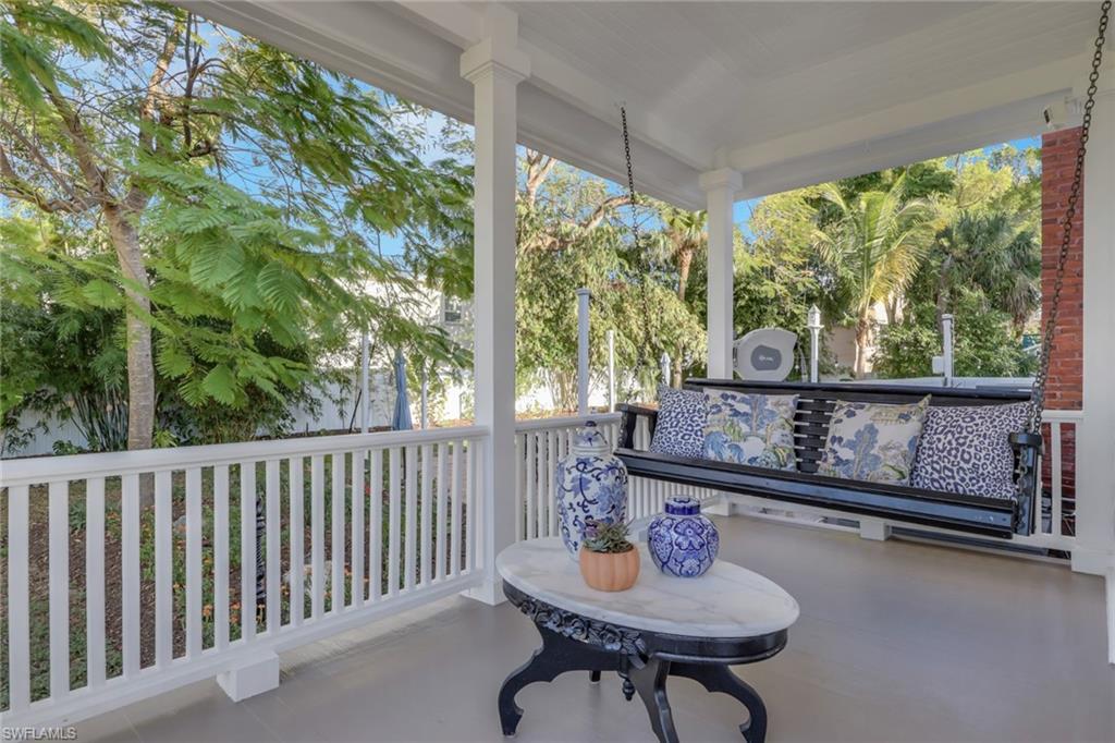 2582 First Street Fort Myers, FL 33901 - Photo 6 of 35 a view of a chairs and tables in the porch