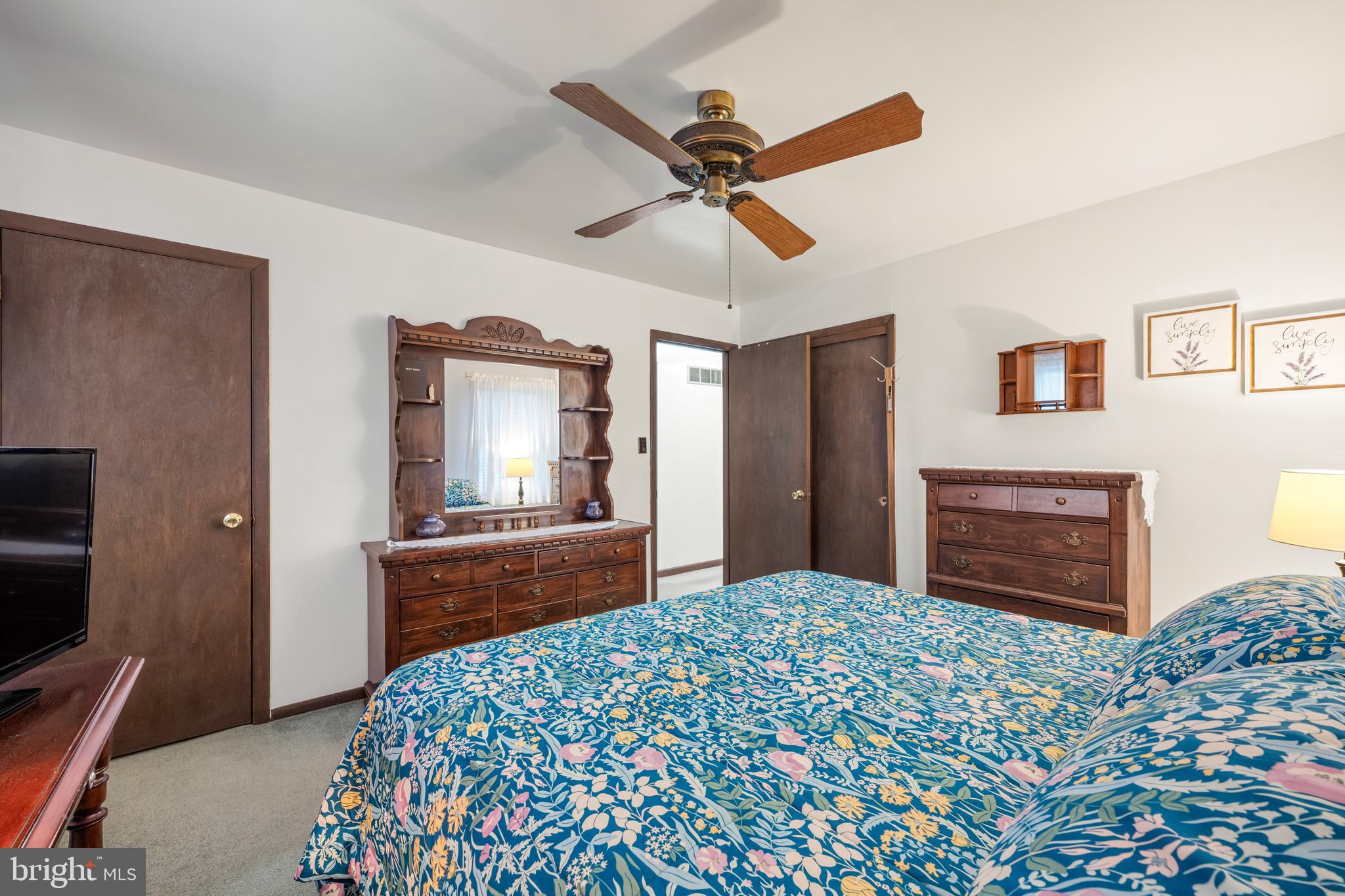 393 Newport Neck Road Newport, NJ 08345 - Photo 11 of 24 a bedroom with a bed and a dresser