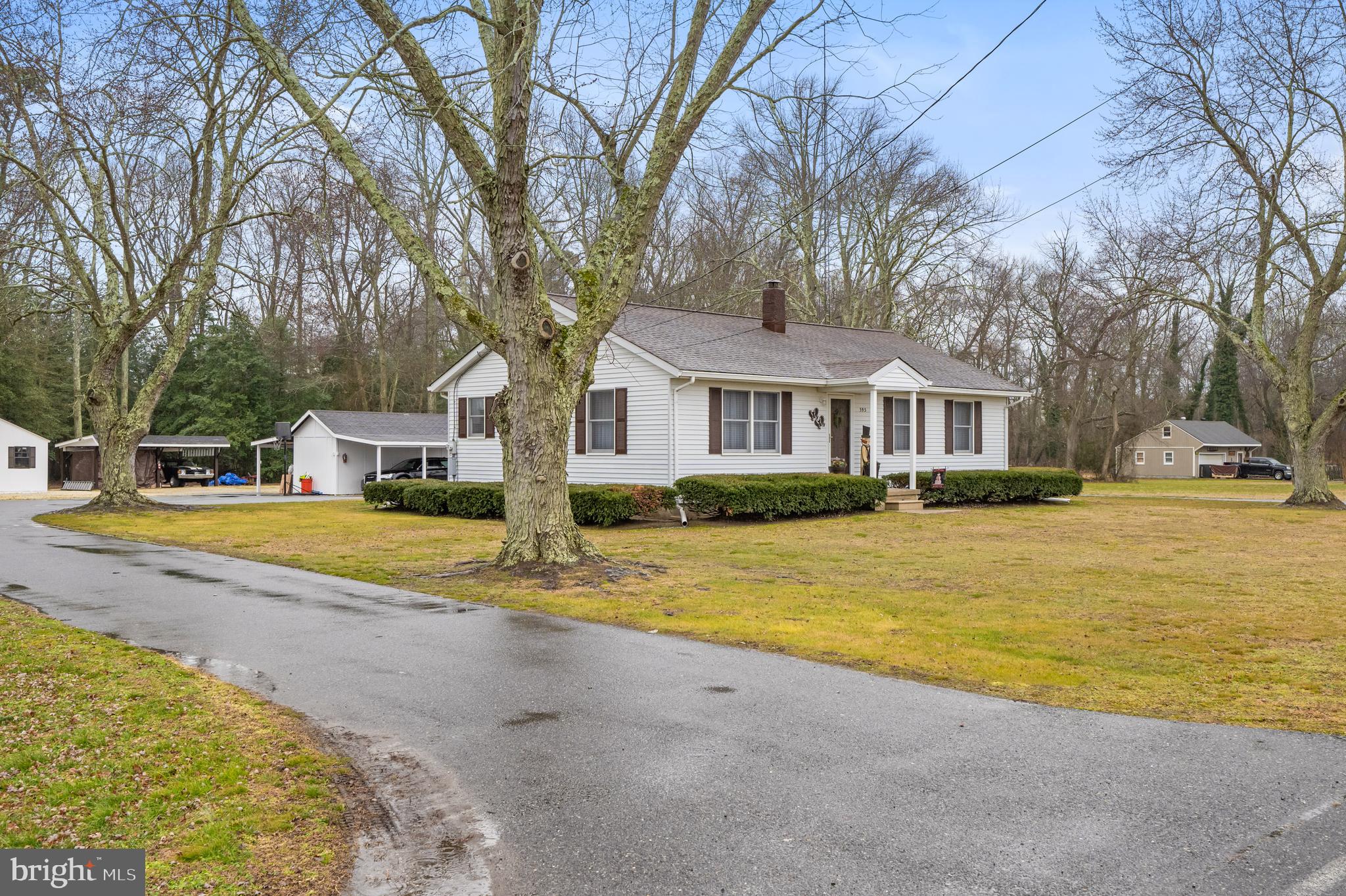 393 Newport Neck Road Newport, NJ 08345 - Photo 2 of 24 a front view of a house with swimming pool and porch