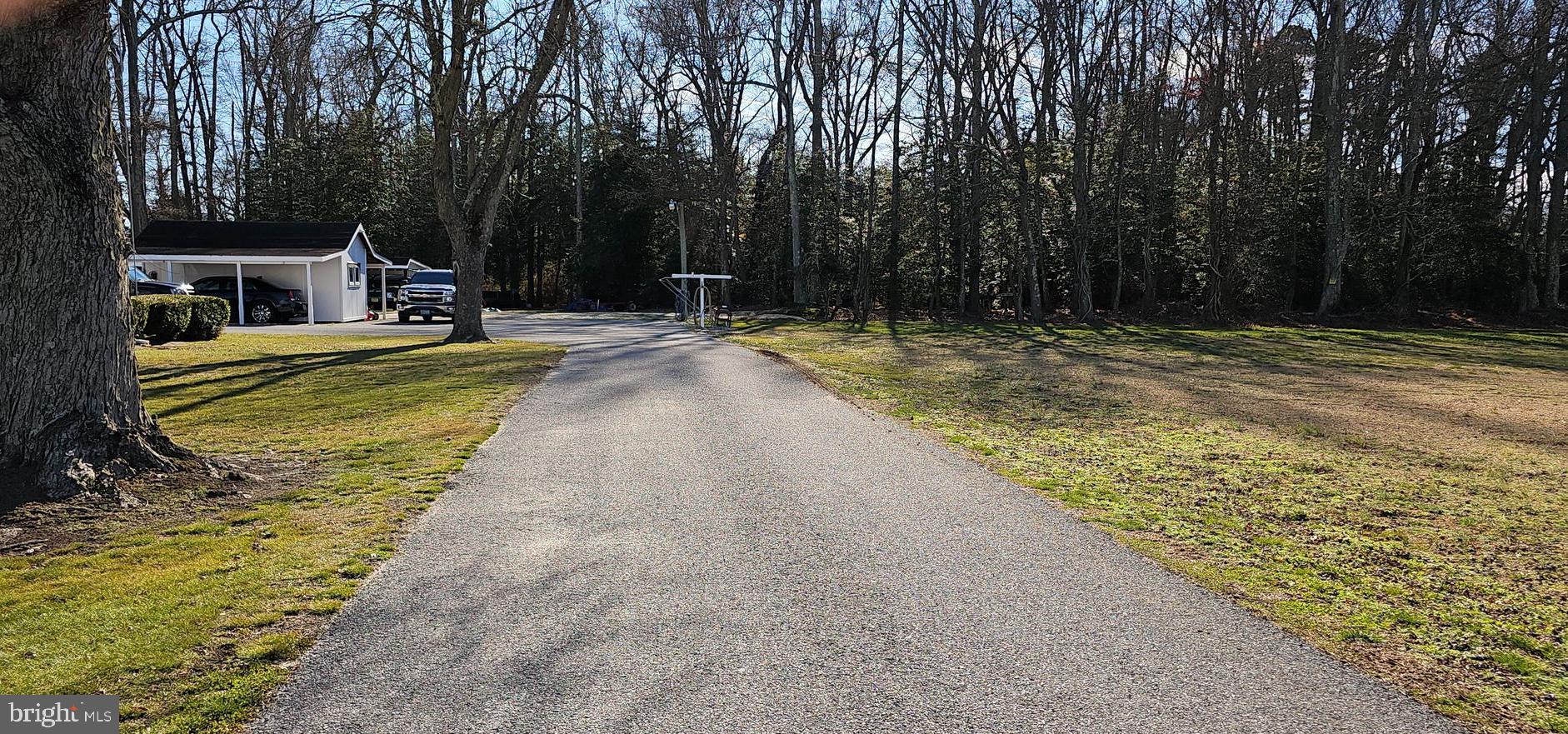 393 Newport Neck Road Newport, NJ 08345 - Photo 3 of 4 a view of a swimming pool with a patio