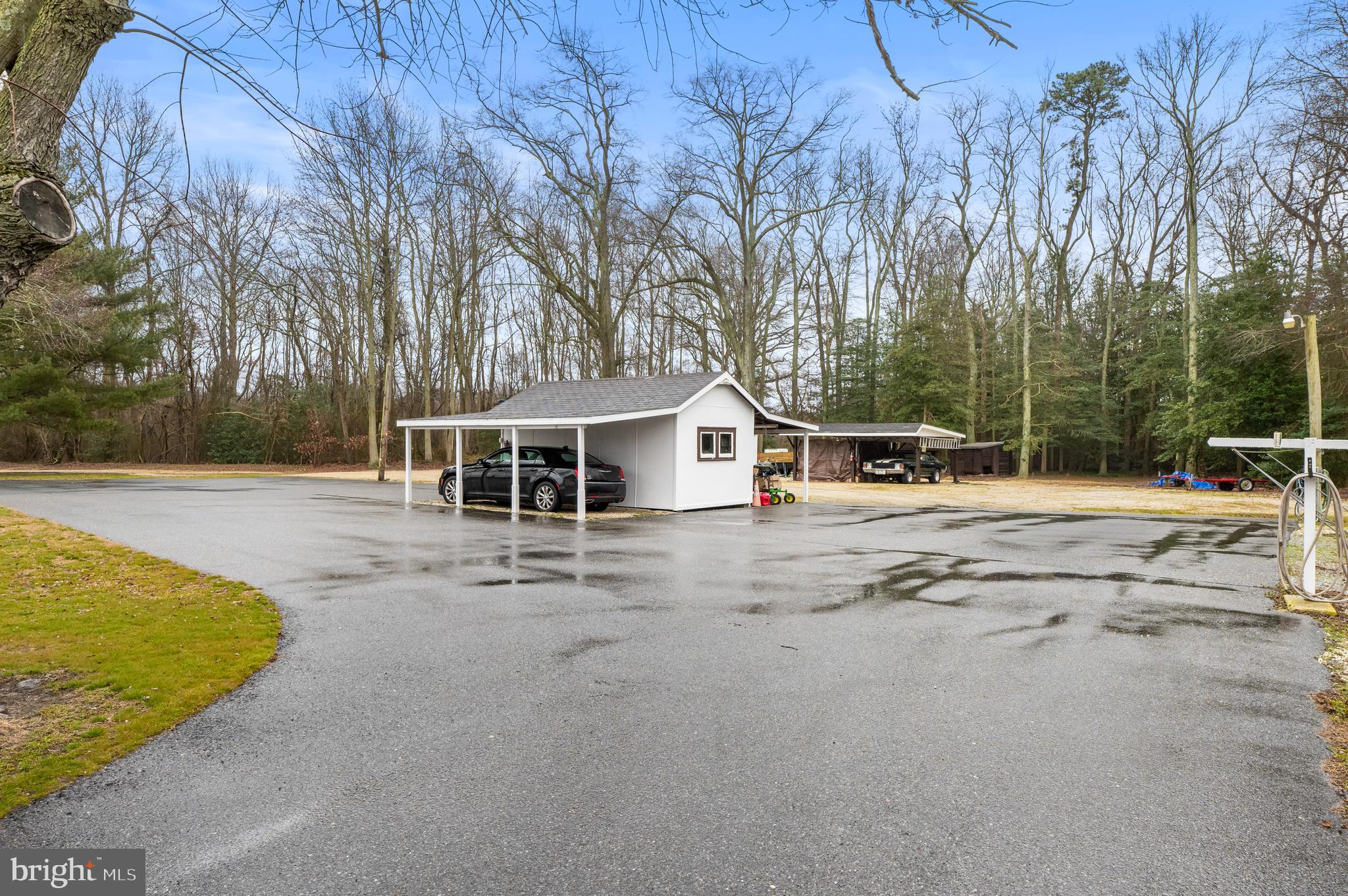 393 Newport Neck Road Newport, NJ 08345 - Photo 4 of 24 a view of a house with snow on the road