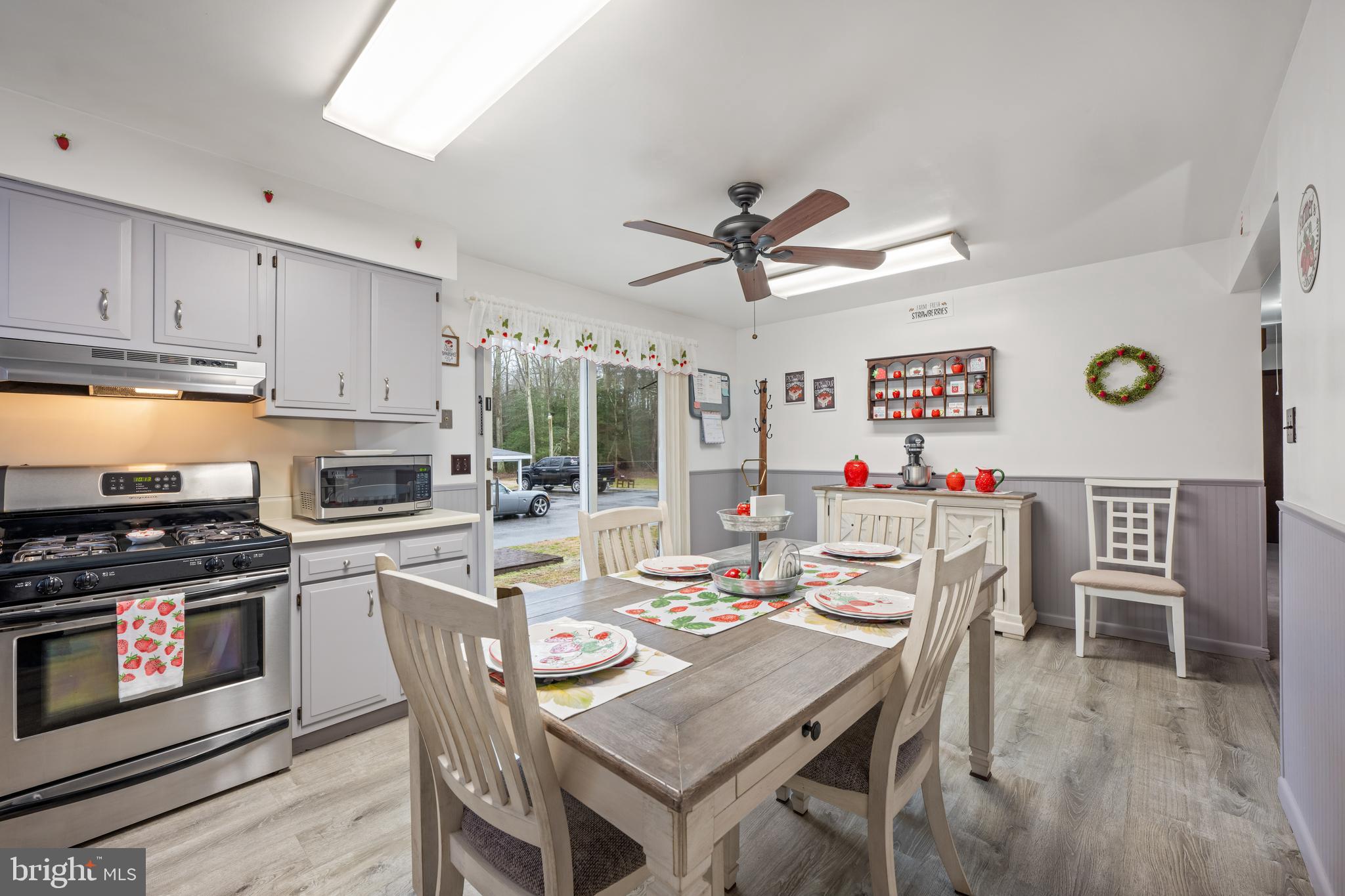 393 Newport Neck Road Newport, NJ 08345 - Photo 7 of 24 a view of a dining room with furniture window and wooden floor