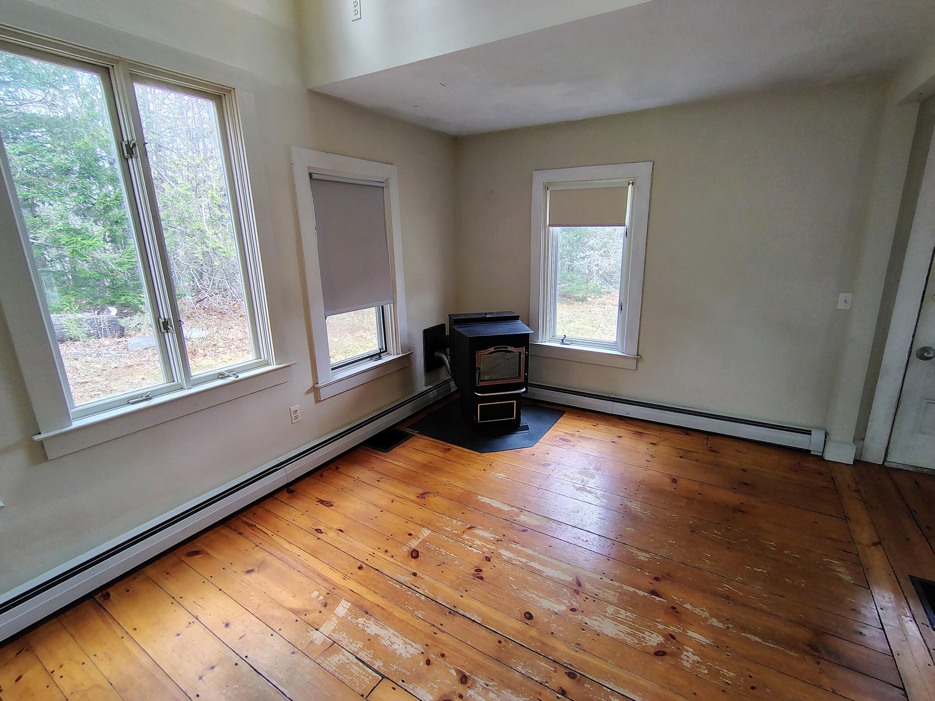 661 Herrick Road Sedgwick, ME 04673 - Photo 14 of 63 Living Room, Pellet Stove