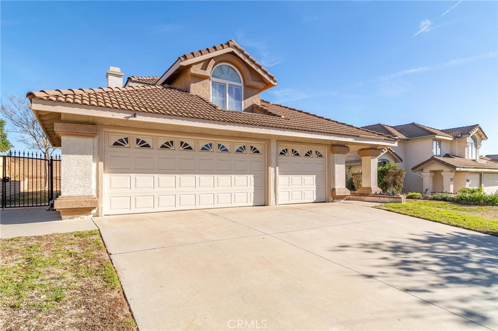 6933 Stanislaus Place Rancho Cucamonga, CA 91701 - Photo 1 of 1 a front view of a house with a yard