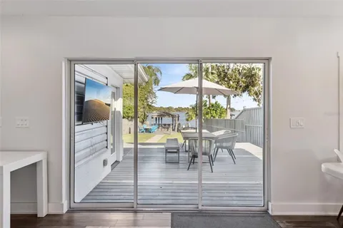 a view or dining room with furniture and wooden floor