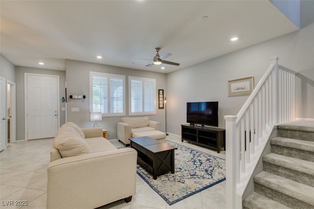 2870 Turnstone Ridge Street Henderson, NV 89044 - Photo 8 of 50 Living area featuring a ceiling fan, light tile patterned floors, recessed lighting, stairway, and baseboards