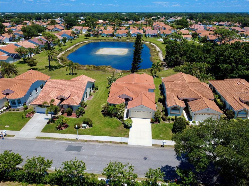 4266 Summertree Road Venice, FL 34293 - Photo 43 of 64 an aerial view of house with yard swimming pool and outdoor seating