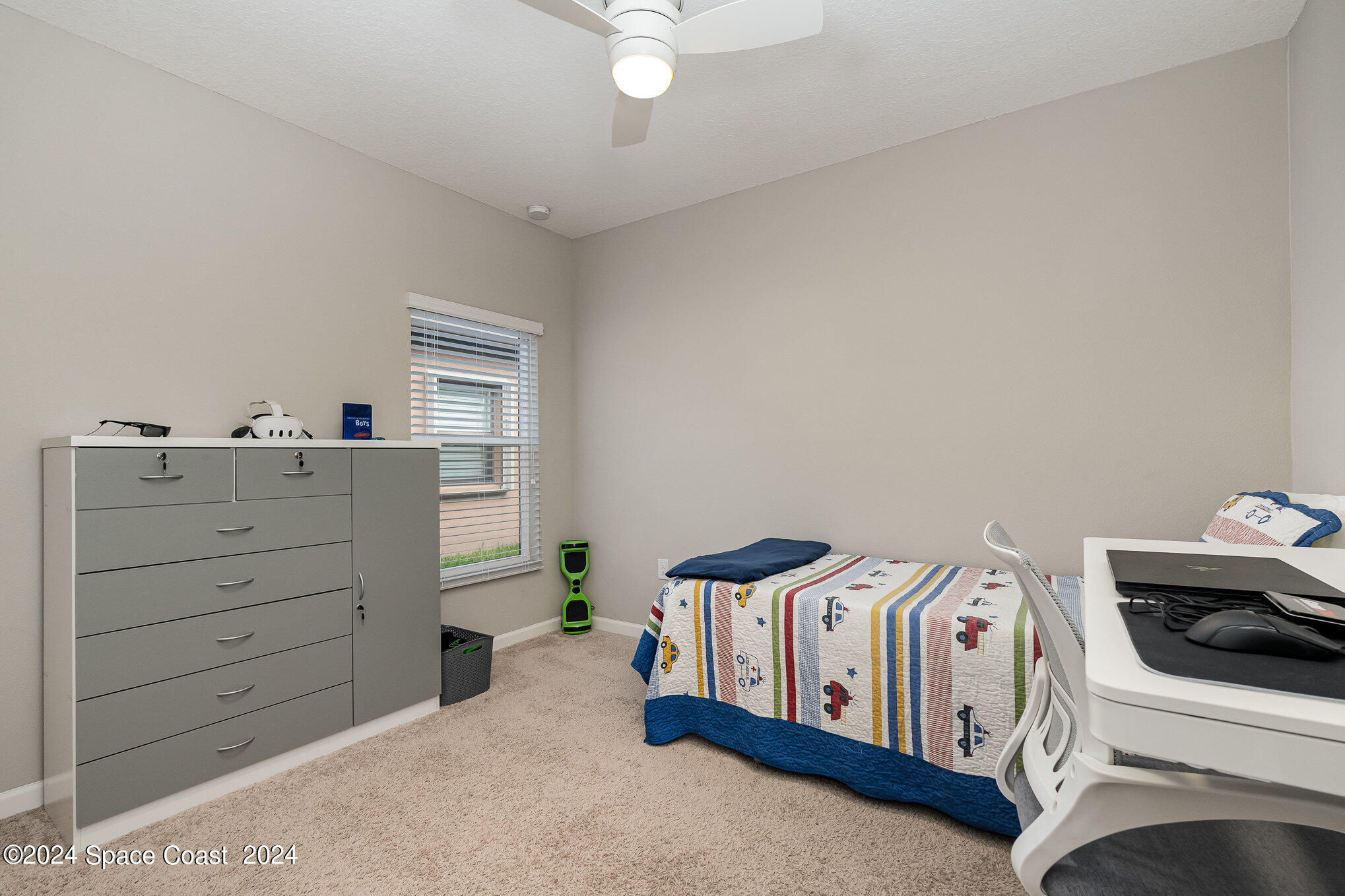 4210 Harvest Circle Rockledge, FL 32955 - Photo 18 of 24 a bedroom with a bed and a cabinets