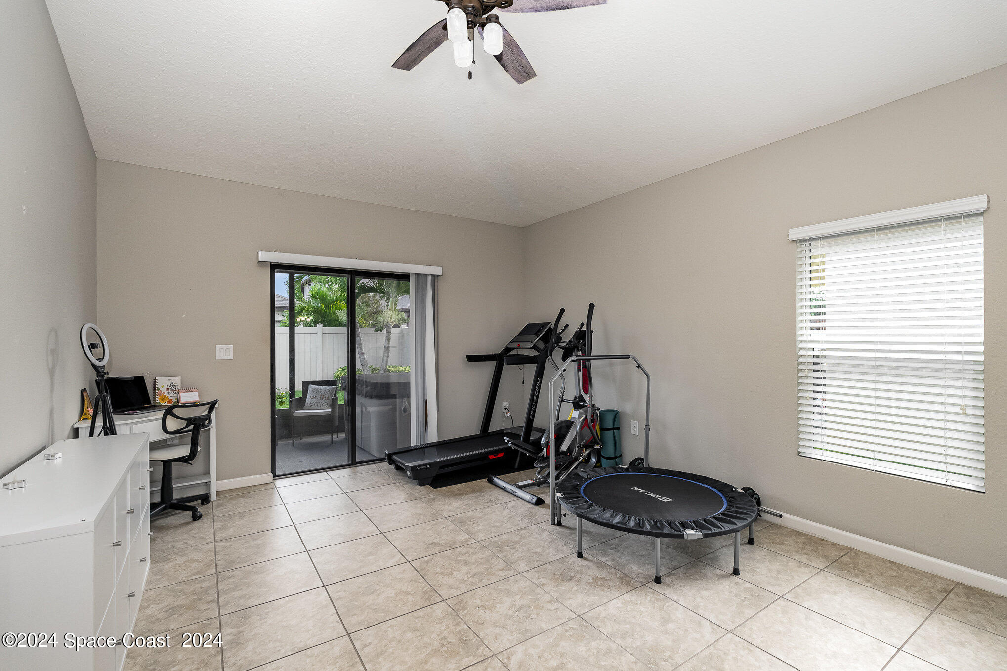 4210 Harvest Circle Rockledge, FL 32955 - Photo 20 of 24 a room with gym equipment and a window