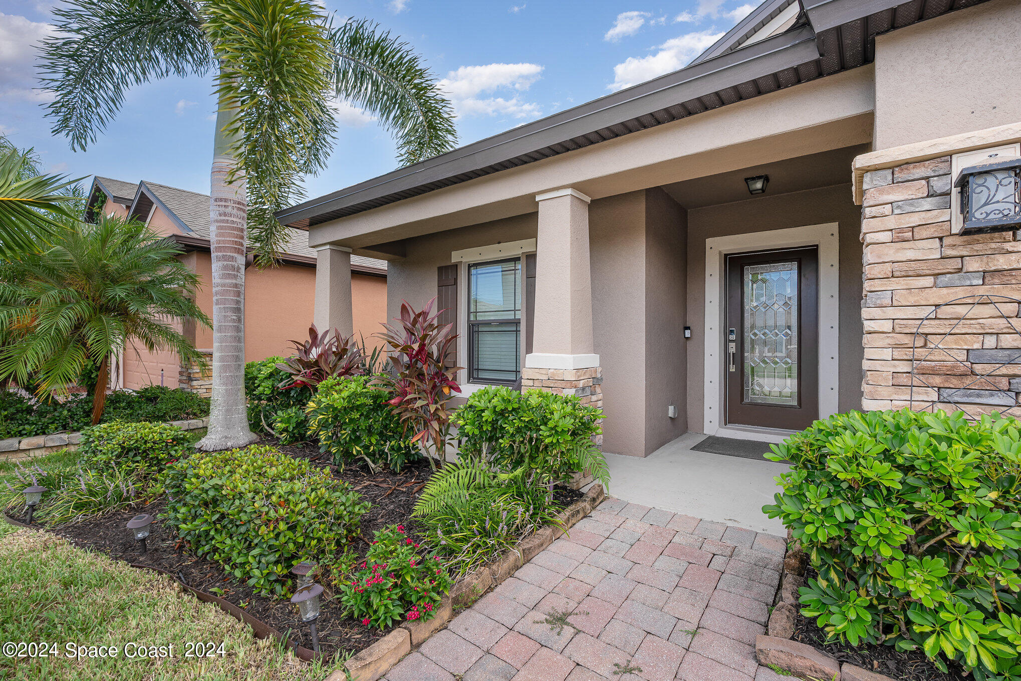 4210 Harvest Circle Rockledge, FL 32955 - Photo 2 of 24 a front view of a house with garden