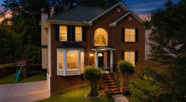 a front view of a house with garden