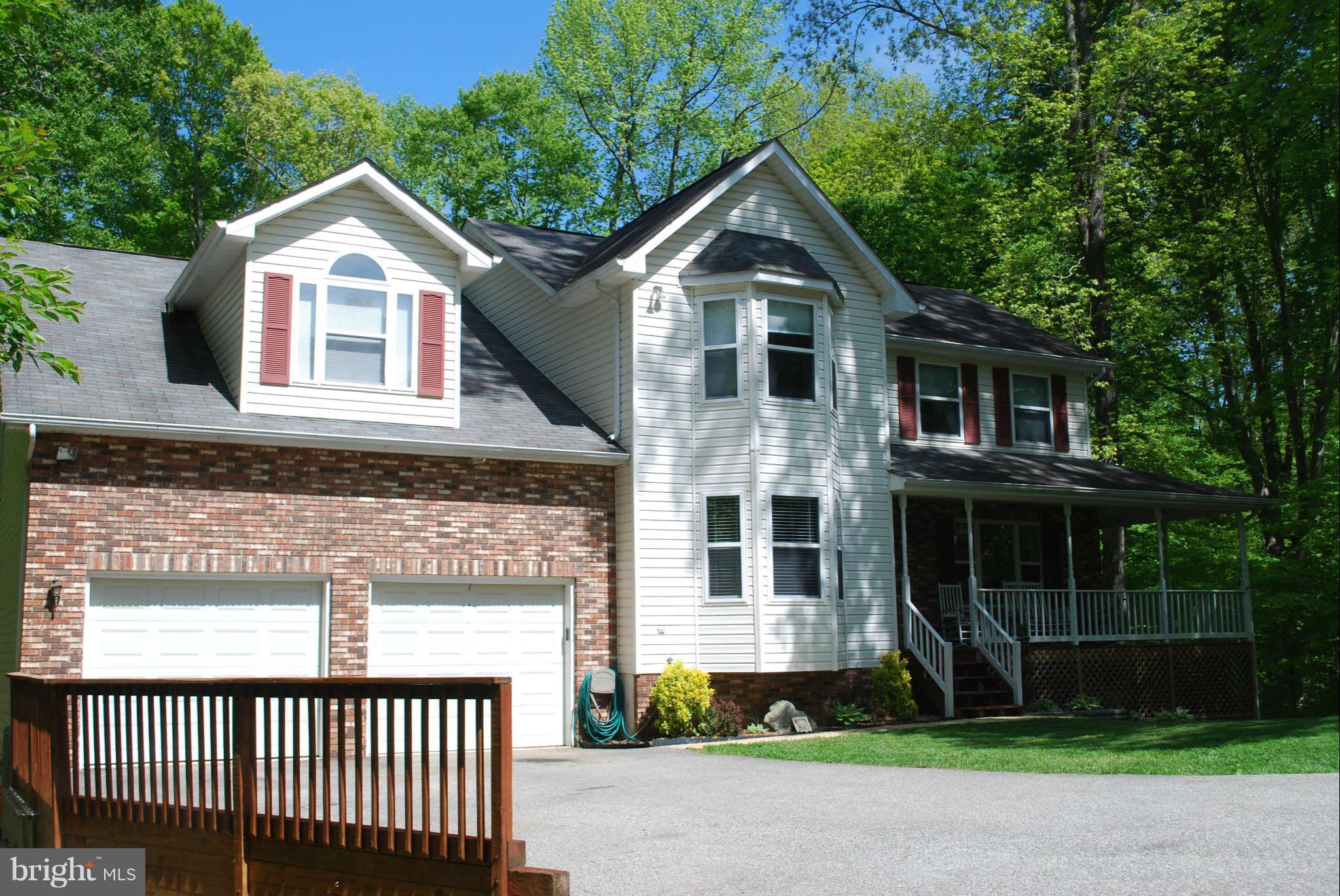 441 Rachaels Way Prince Frederick, MD 20678 - Photo 2 of 30 a front view of a house with a yard