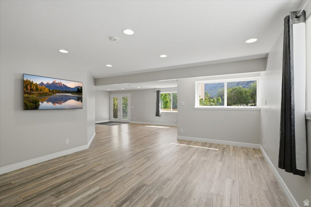 12317 Cypress Point Way Draper, UT 84020 - Photo 27 of 41 Open concept living area featuring wood-finish flooring and walk out