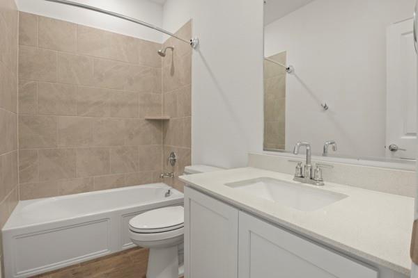 224 Cherryvale Lane Princeton, TX 75407 - Photo 18 of 28 a bathroom with a sink a toilet and a bathtub