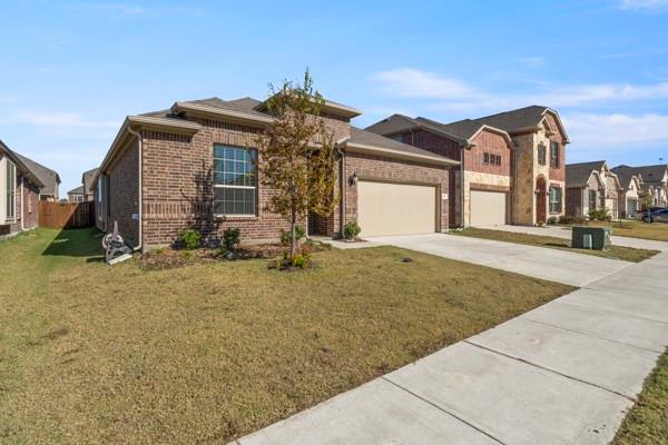 224 Cherryvale Lane Princeton, TX 75407 - Photo 2 of 28 a view of a house with many windows
