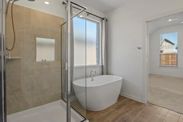 a bathroom with a sink a mirror and a bathtub