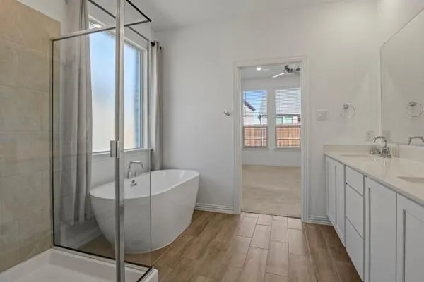 a bathroom with a double vanity sink and mirror