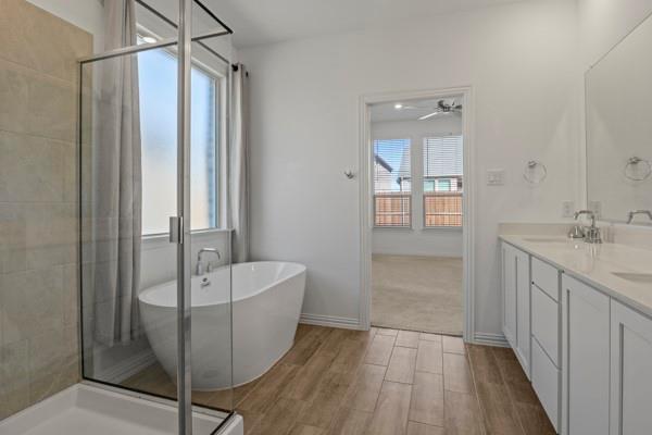 224 Cherryvale Lane Princeton, TX 75407 - Photo 25 of 28 a bathroom with a sink a mirror and a bathtub