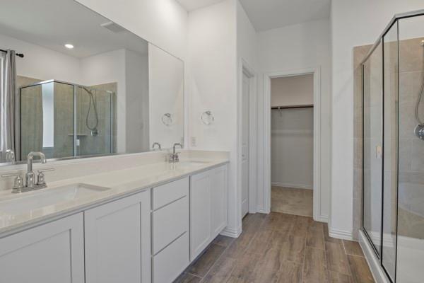 224 Cherryvale Lane Princeton, TX 75407 - Photo 26 of 28 a bathroom with a double vanity sink and mirror