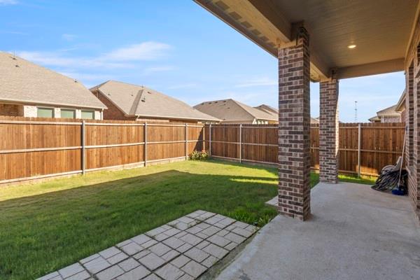224 Cherryvale Lane Princeton, TX 75407 - Photo 27 of 28 a view of a garden with a bench in the patio