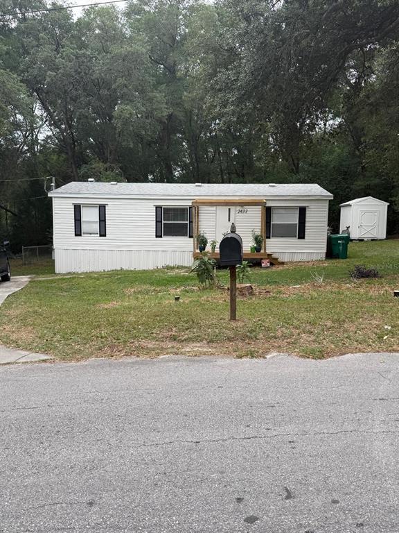 2433 East North Street Inverness, FL 34453 - Photo 1 of 11 a front view of a house with garden