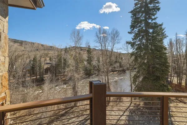 a view of a balcony with a tree
