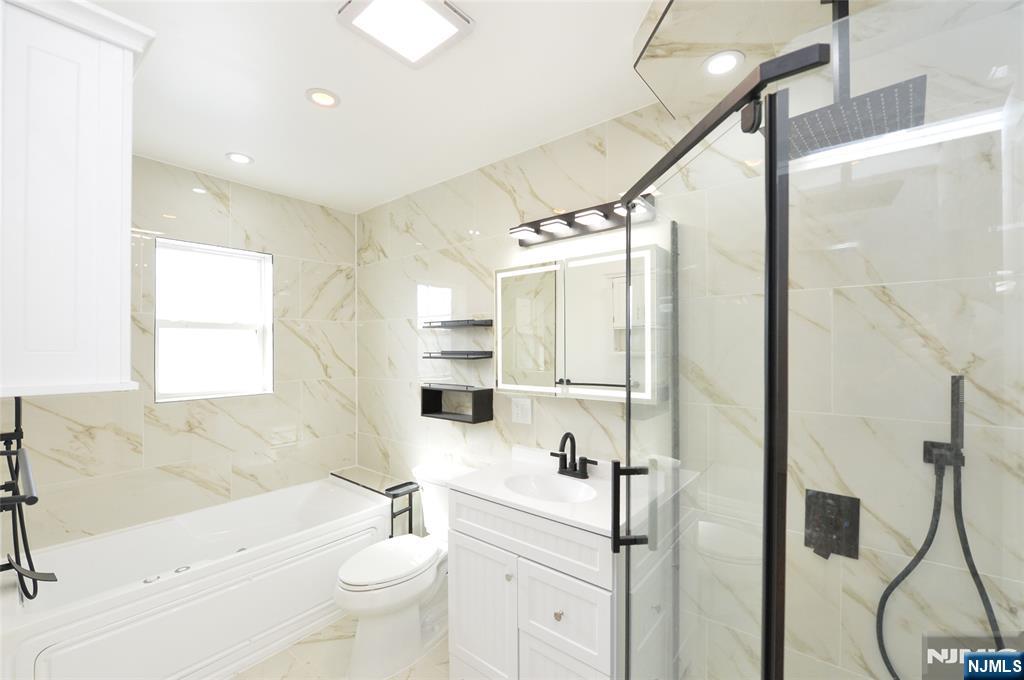 100 Eastern Way Rutherford, NJ 07070 - Photo 14 of 19 a bathroom with a sink a toilet and shower