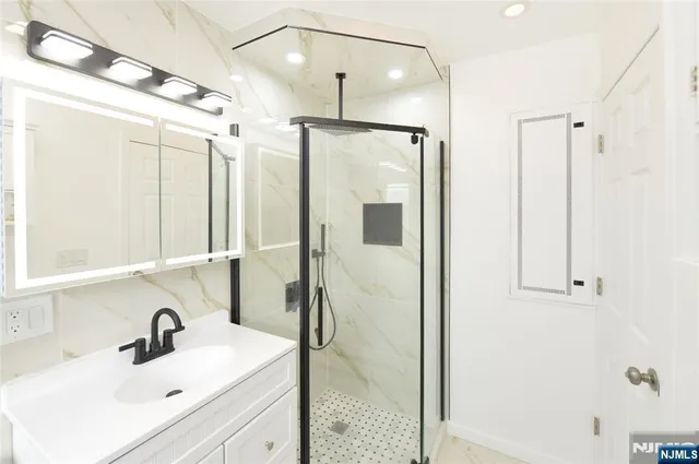 a bathroom with a sink and a mirror