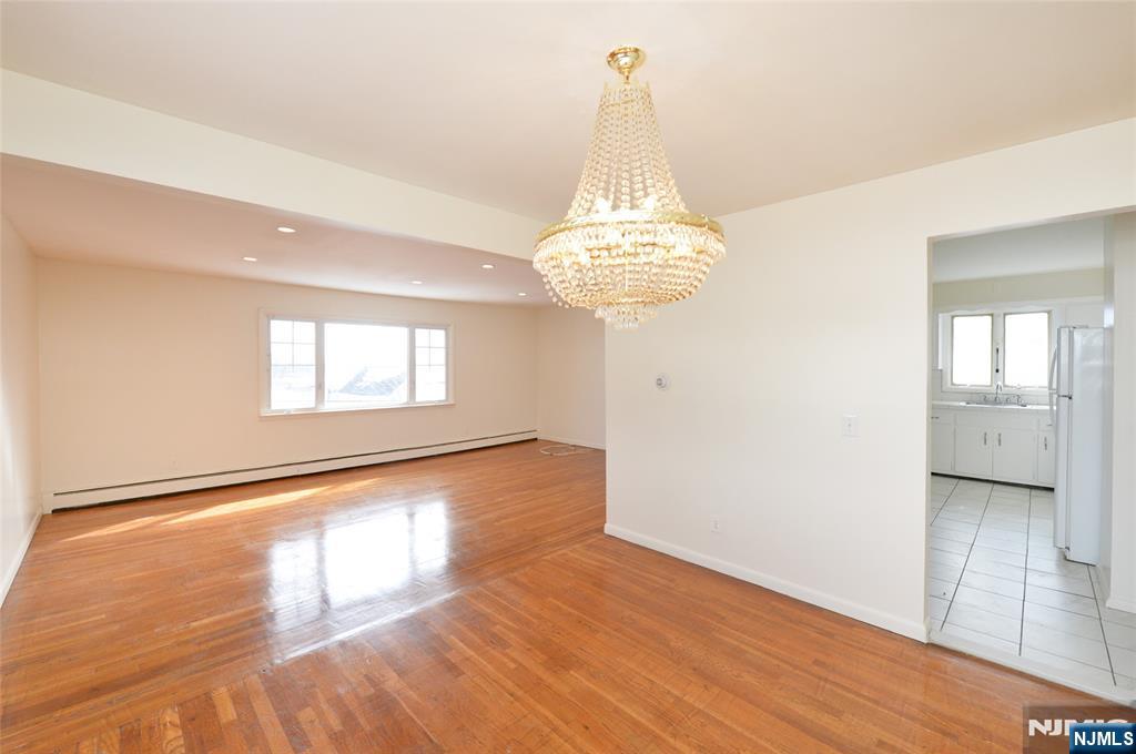100 Eastern Way Rutherford, NJ 07070 - Photo 6 of 19 a view of empty room with wooden floor and fan