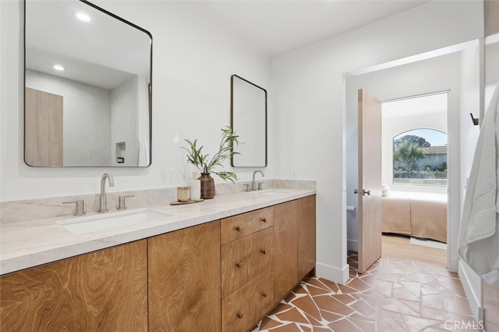 8140 Calabar Avenue Playa del Rey, CA 90293 - Photo 35 of 60 a bathroom with a double vanity sink and a mirror